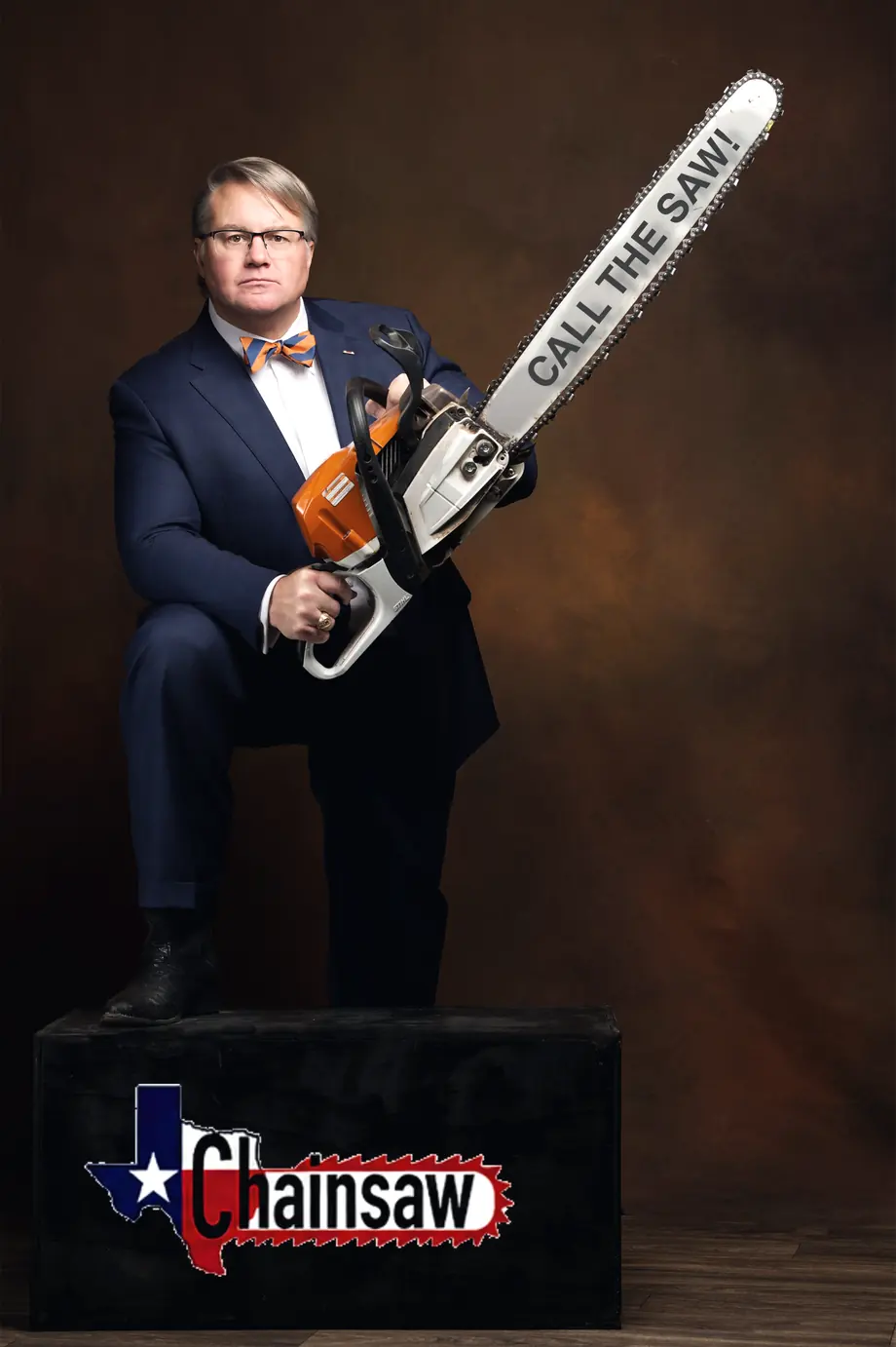 Mark Braswell holding a chainsaw, ready to work